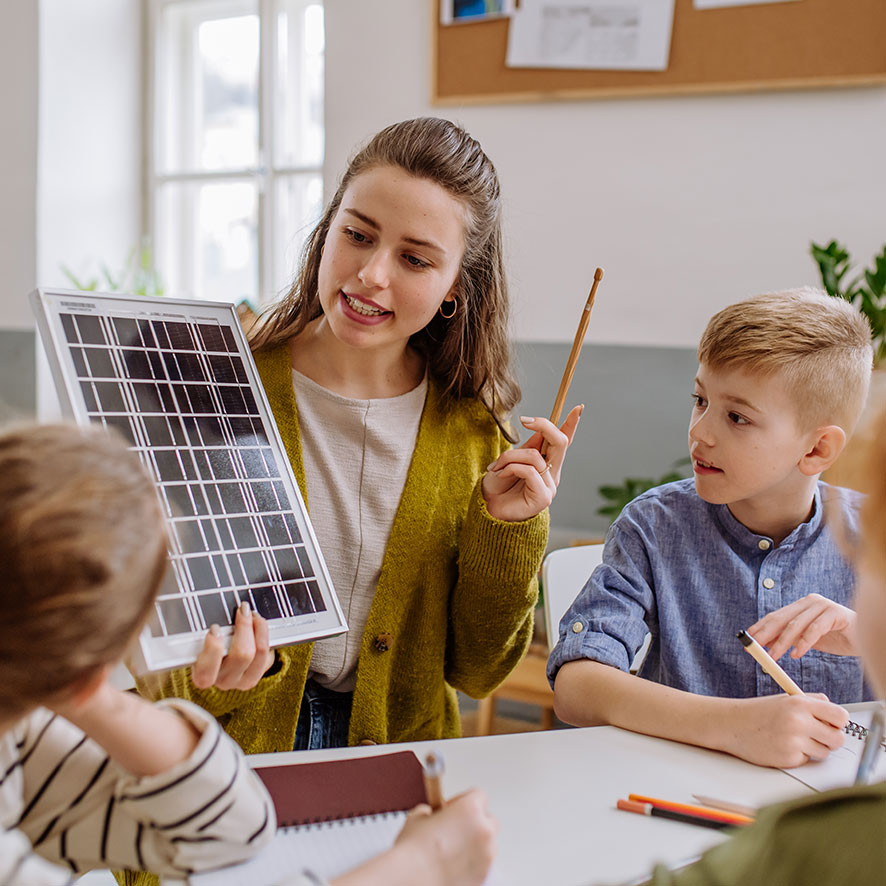 web-young-teacher-with-solar-panel-learning-pupils-abo-2023-04-04-18-31-41-utc